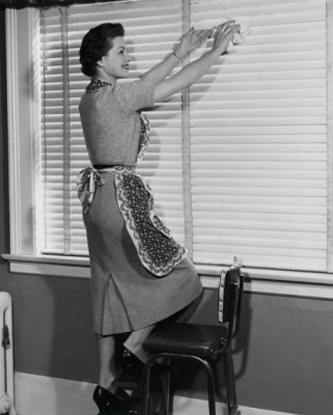 Side profile of a young woman cleaning window blinds Canvas Art - (18 x 24)