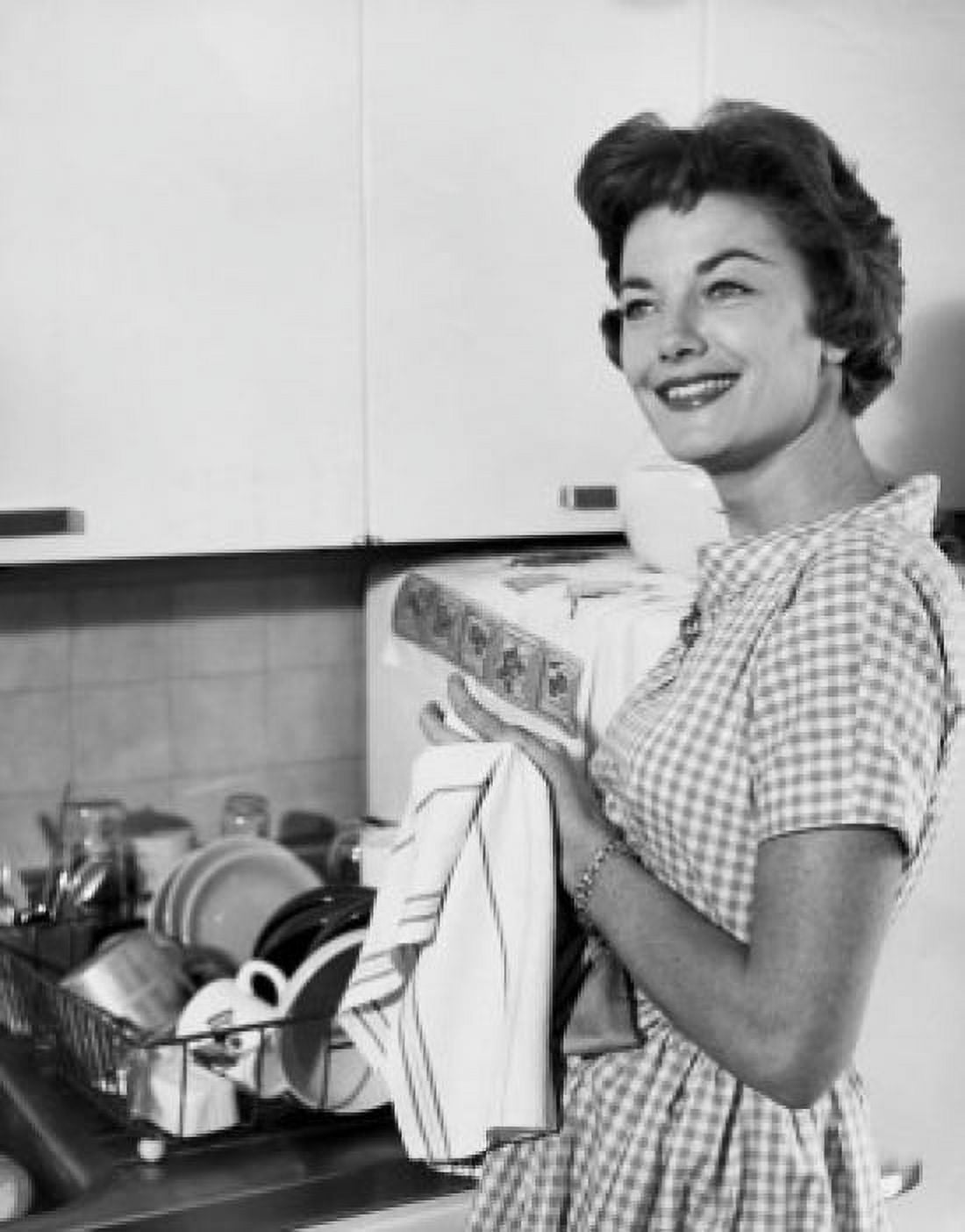 Side profile of a young woman drying her hands with a dish cloth Canvas Art - (18 x 24)