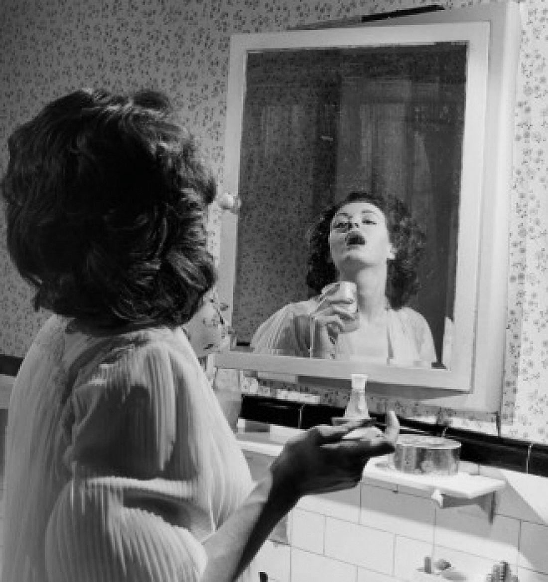 Side profile of a young woman gargling in front of a mirror Canvas Art - (24 x 36)