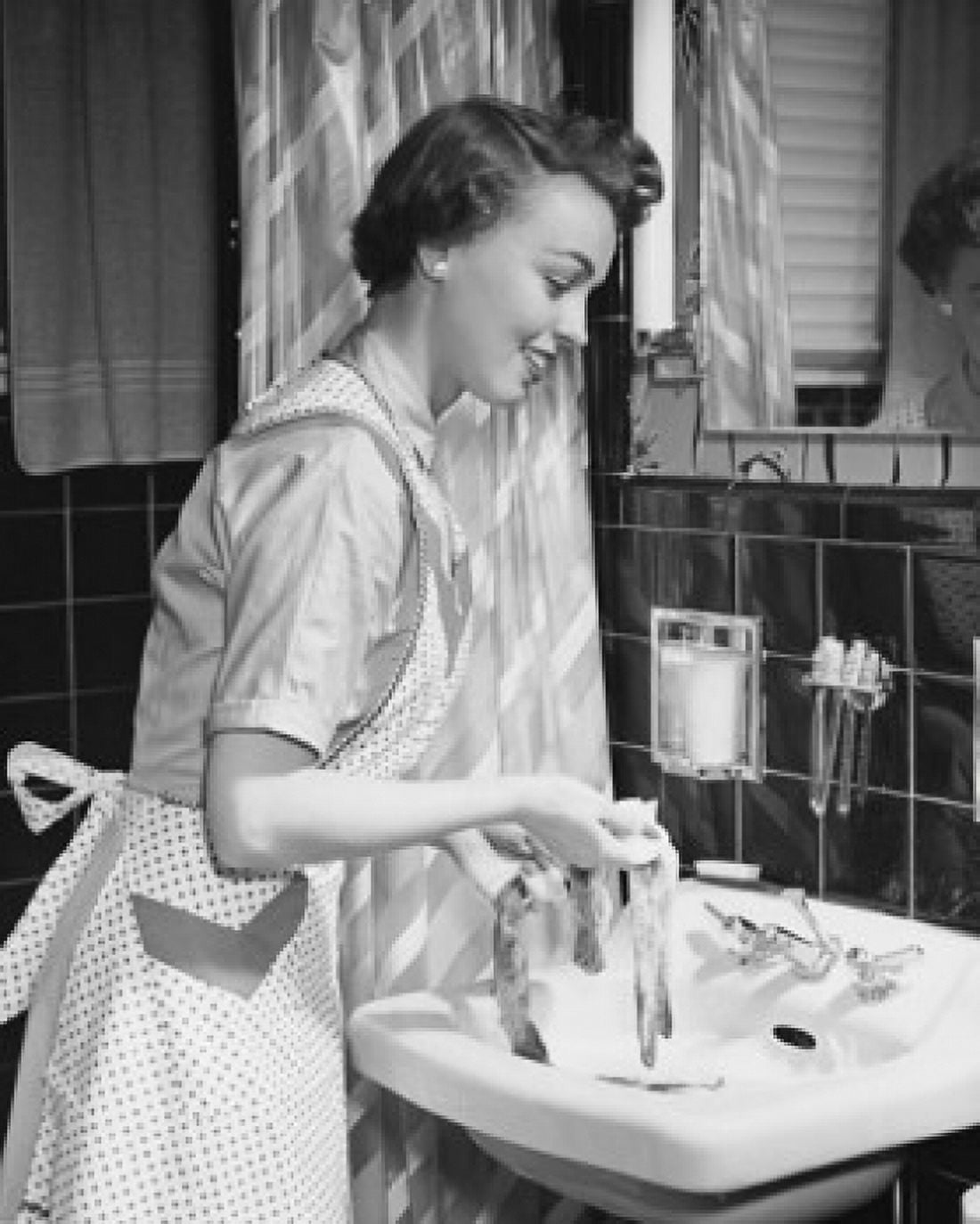Side profile of a young woman hand washing clothes in the bathroom sink Canvas Art - (18 x 24)