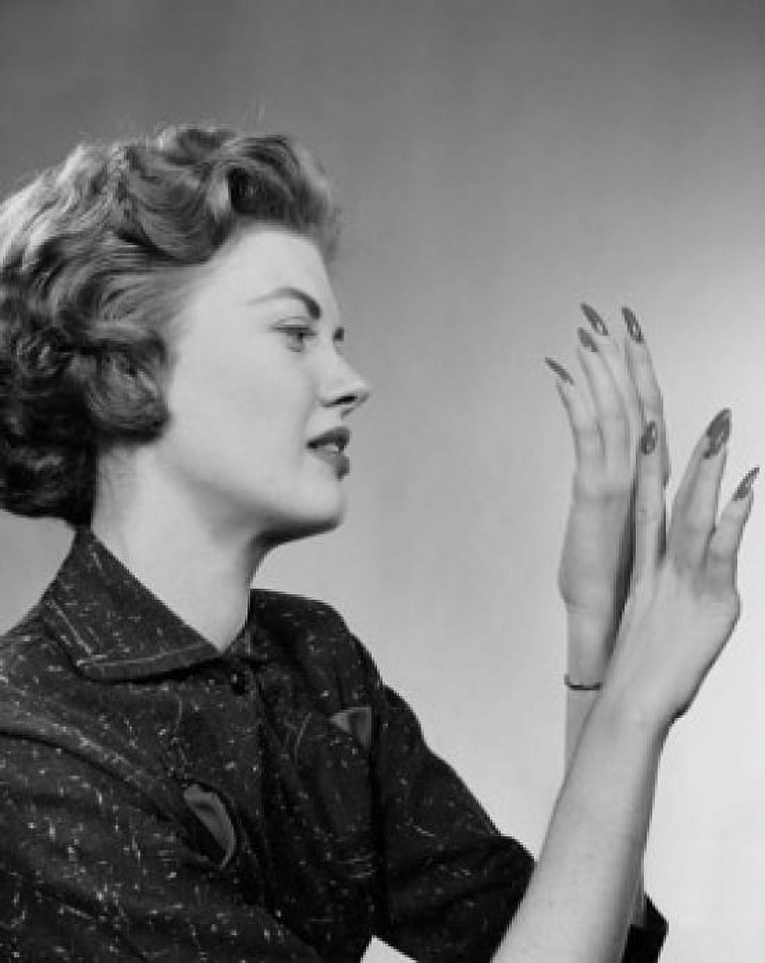 Side profile of a young woman looking at her fingernails Canvas Art - (18 x 24)