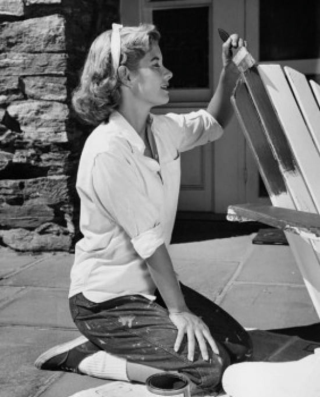 Side profile of a young woman painting an adirondack chair Canvas Art - (24 x 36)