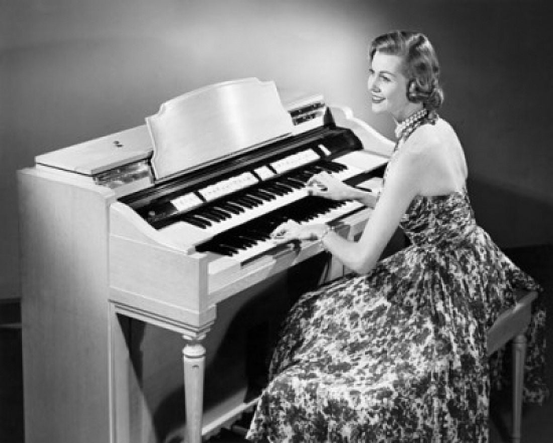 Side profile of a young woman playing an organ Canvas Art - (18 x 24)