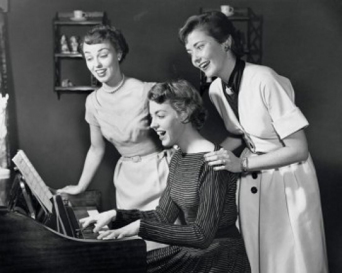 Side profile of a young woman playing the piano with two young women standing behind her Canvas Art - (18 x 24)