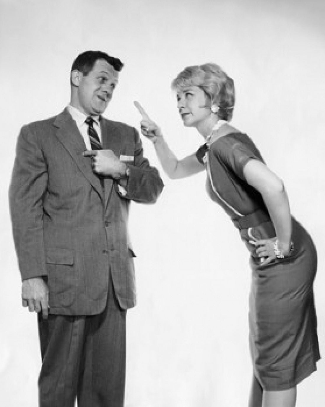 Side profile of a young woman pointing her finger at a young man Canvas Art - (18 x 24)