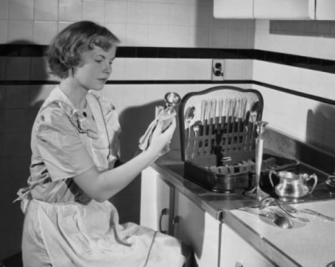 Side profile of a young woman polishing a candlestick holder with a cloth Canvas Art - (18 x 24)