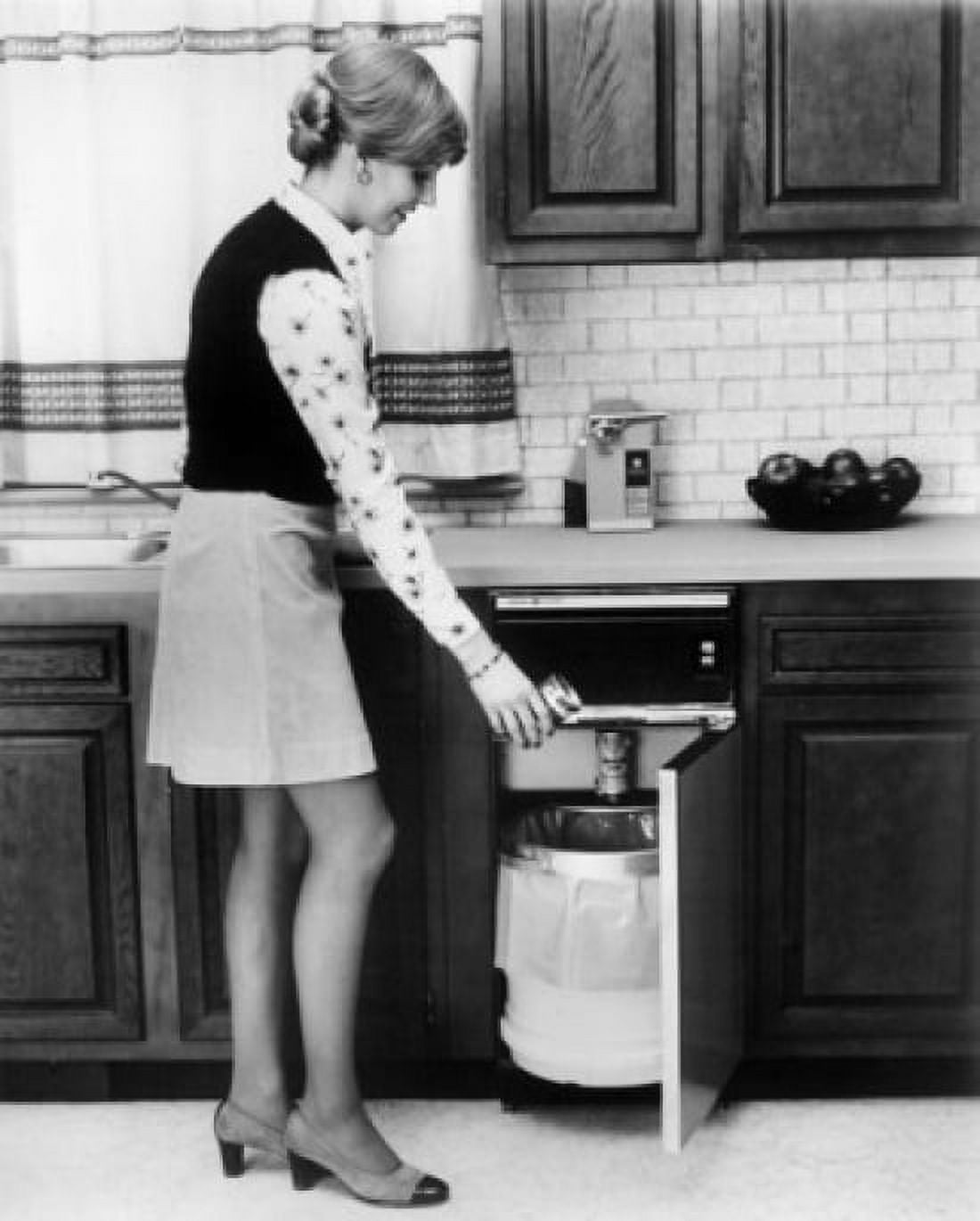 Side profile of a young woman putting a can in a garbage bin Canvas Art - (18 x 24)