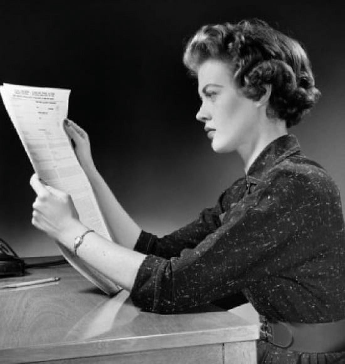 Side profile of a young woman reading a form Canvas Art - (18 x 24)