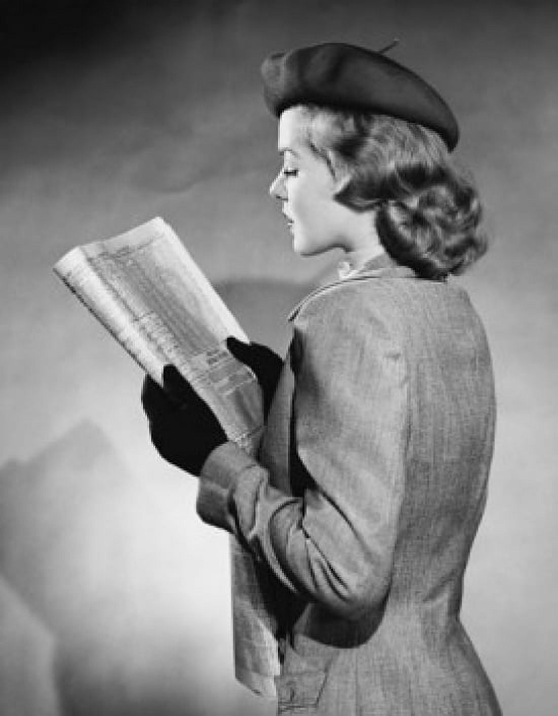 Side profile of a young woman reading a newspaper Canvas Art - (24 x 36)