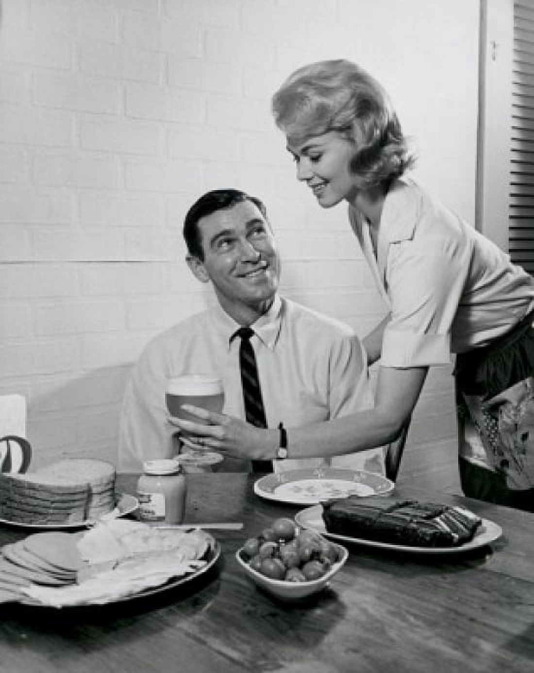 Side profile of a young woman serving food to a young man Canvas Art - (18 x 24)