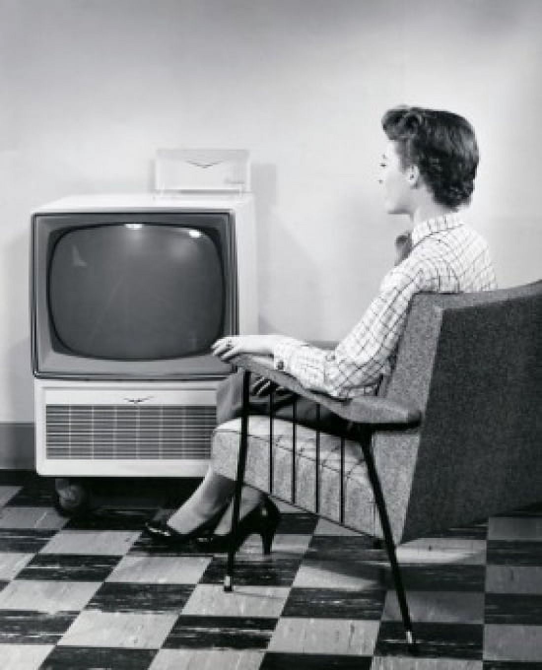 Side profile of a young woman sitting in front of a television Canvas Art - (18 x 24)