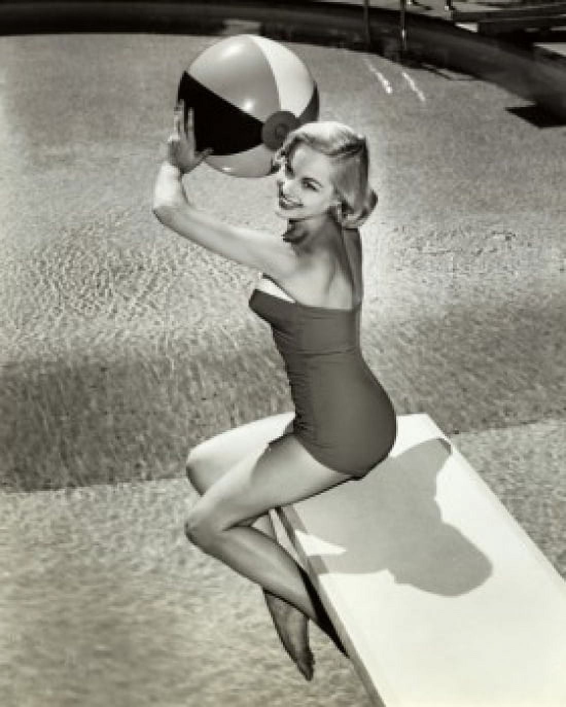 Side profile of a young woman sitting on a diving board holding a beach ball Canvas Art - (18 x 24)