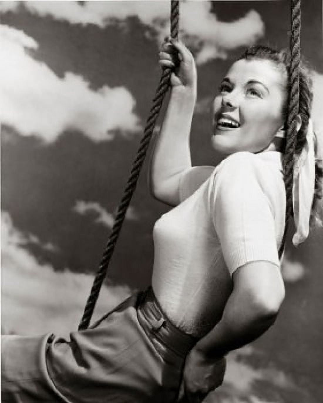 Side profile of a young woman sitting on a swing Canvas Art - (18 x 24)