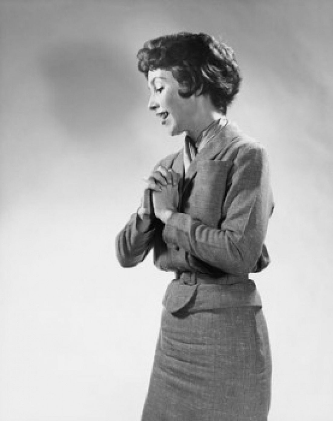 Side profile of a young woman standing with her hands clasped Canvas Art - (18 x 24)
