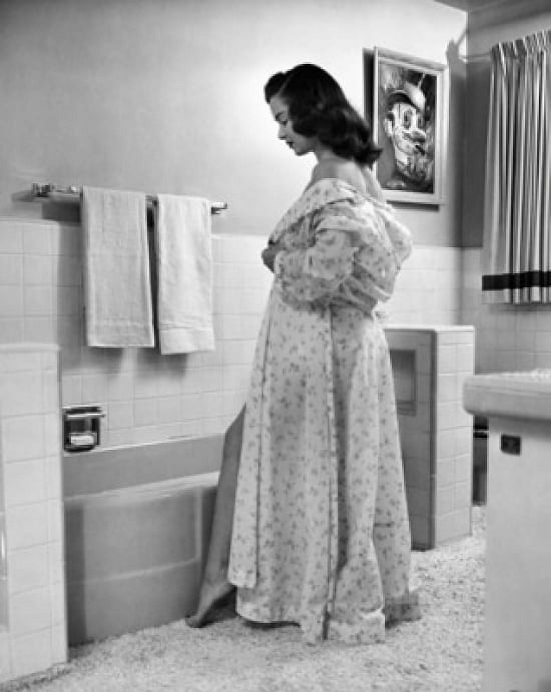 Side profile of a young woman taking off her robe Canvas Art - (24 x 36)