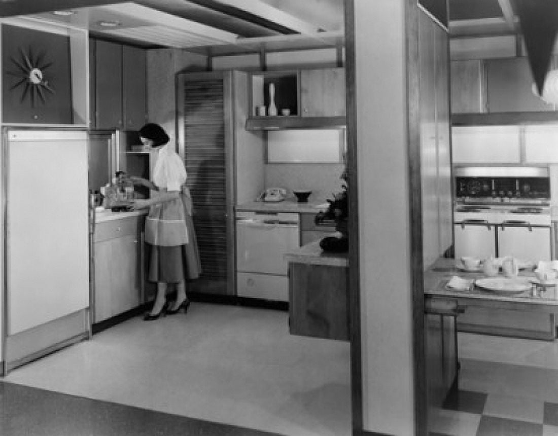 Side profile of a young woman working in the kitchen Canvas Art - (24 x 36)