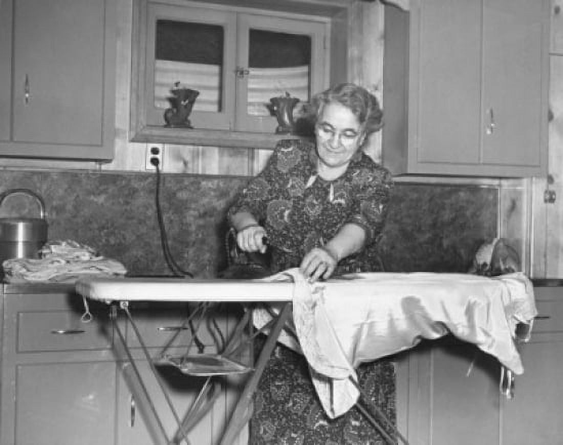 Side profile of a young woman working on an embroidery machine Canvas Art - (18 x 24)