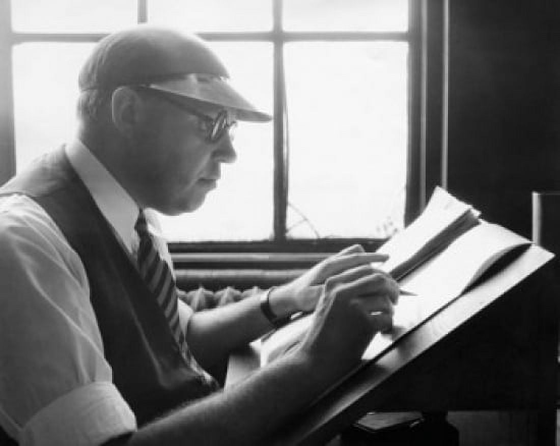 Side profile of an editor reviewing a paper Canvas Art - (18 x 24)