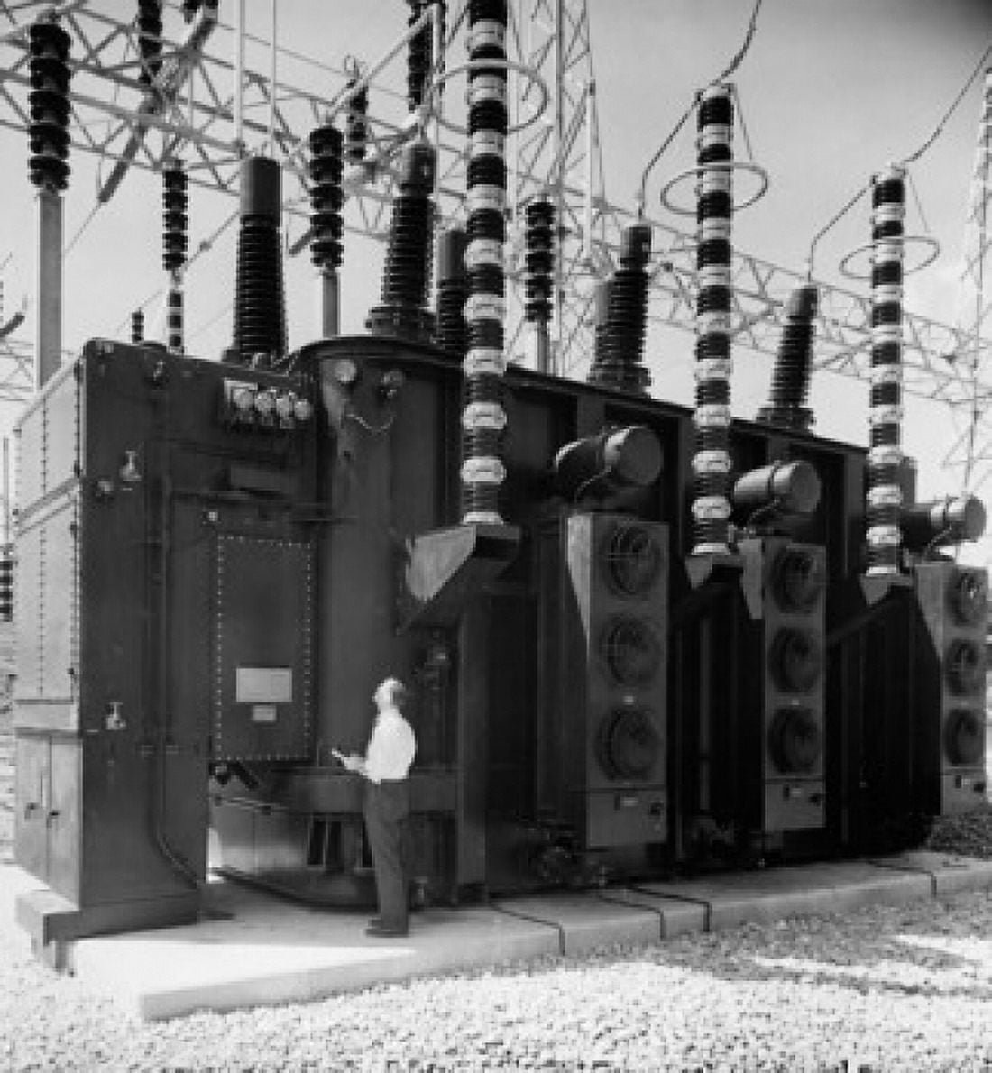Side profile of an engineer standing near an electrical autotransformer Canvas Art - (24 x 36)