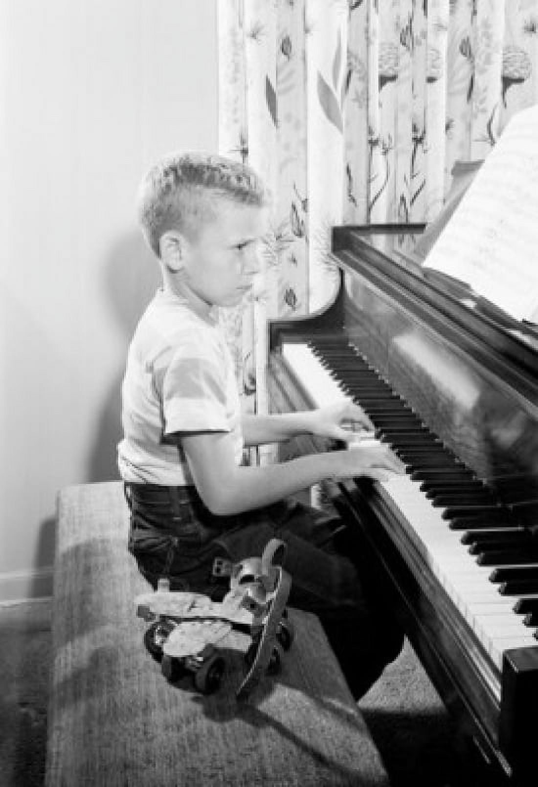 Side profile of boy playing piano Canvas Art - (18 x 24)