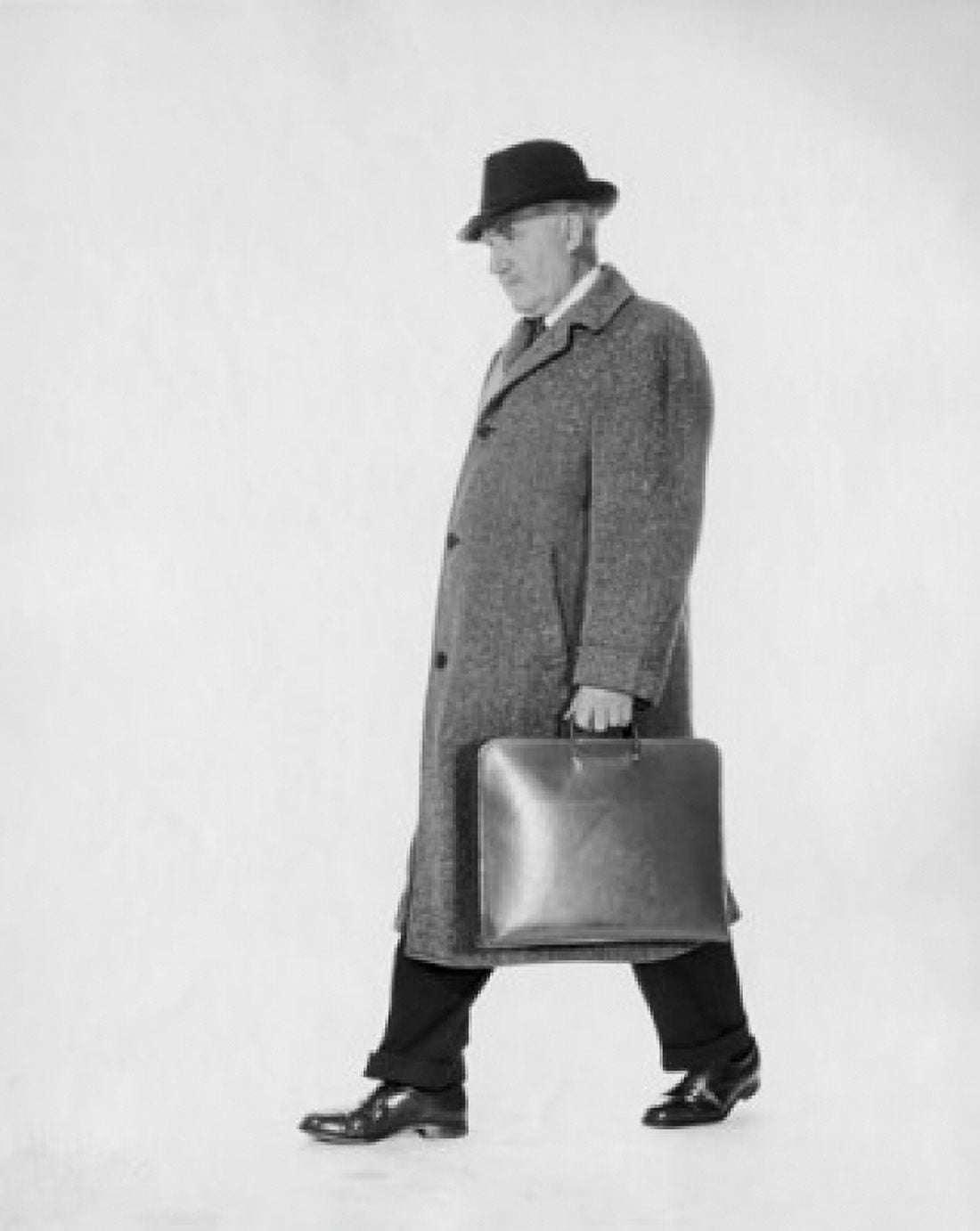 Side profile of businessman carrying briefcase Canvas Art - (18 x 24)