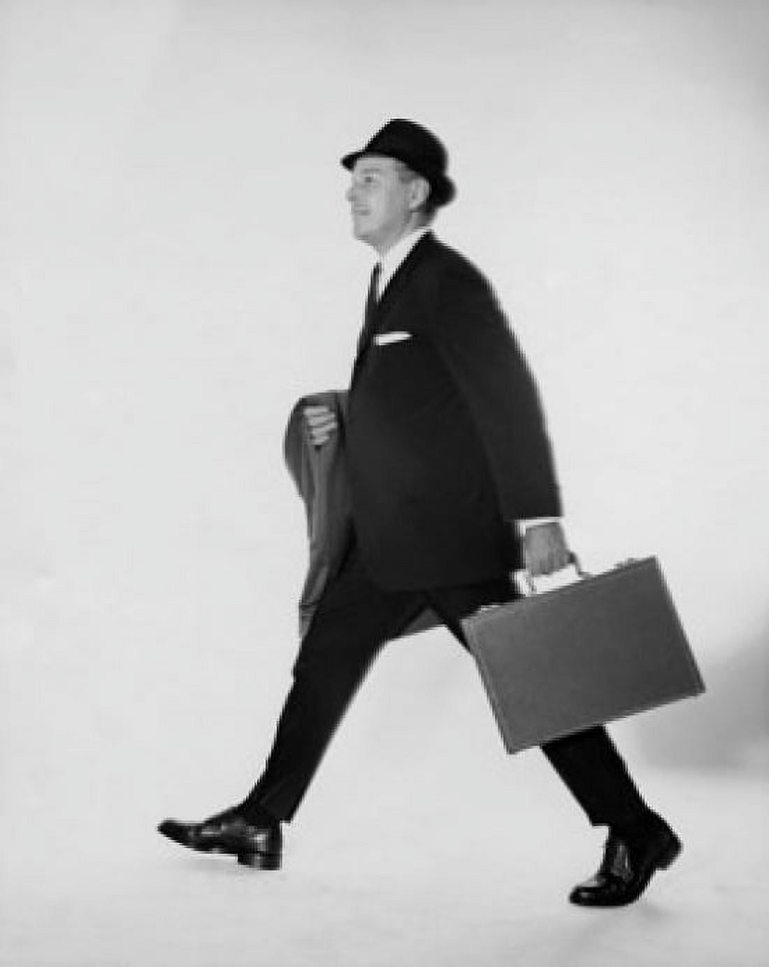 Side profile of businessman carrying briefcase and an overcoat Canvas Art - (18 x 24)