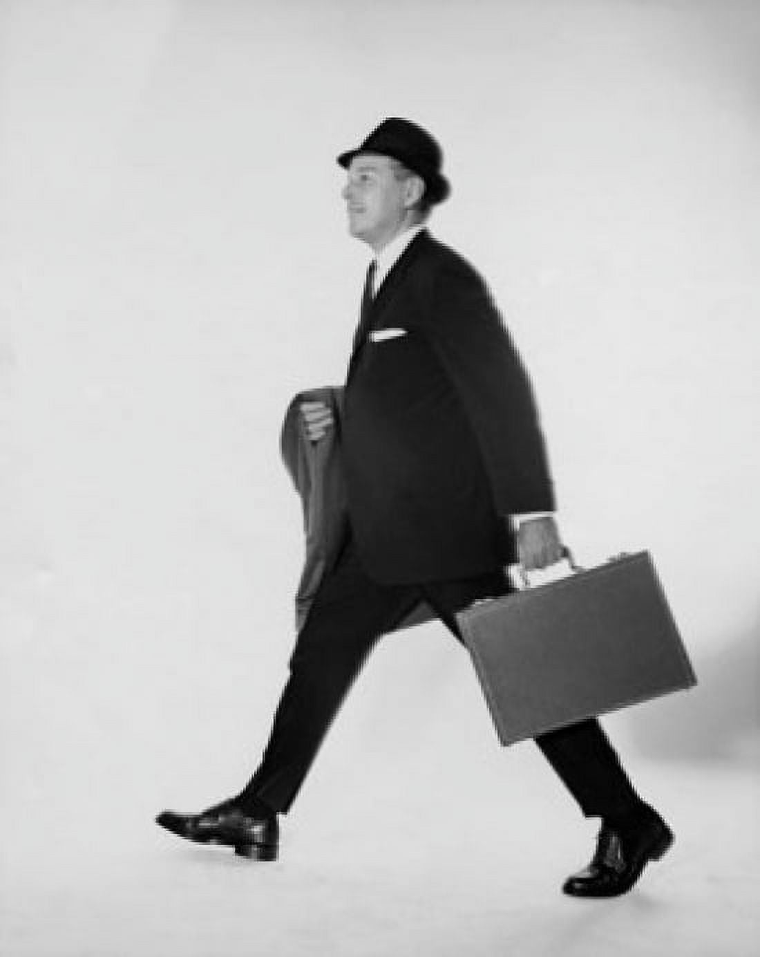 Side profile of businessman carrying briefcase and an overcoat Canvas Art - (24 x 36)