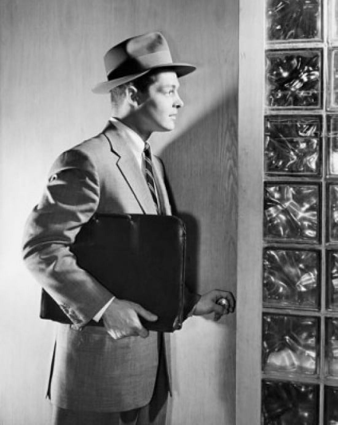 Side profile of businessman holding briefcase Canvas Art - (18 x 24)