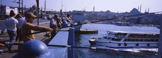 Side profile of fishermen fishing in a river Galata Bridge Istanbul Turkey Canvas Art - Panoramic Images (36 x 13)