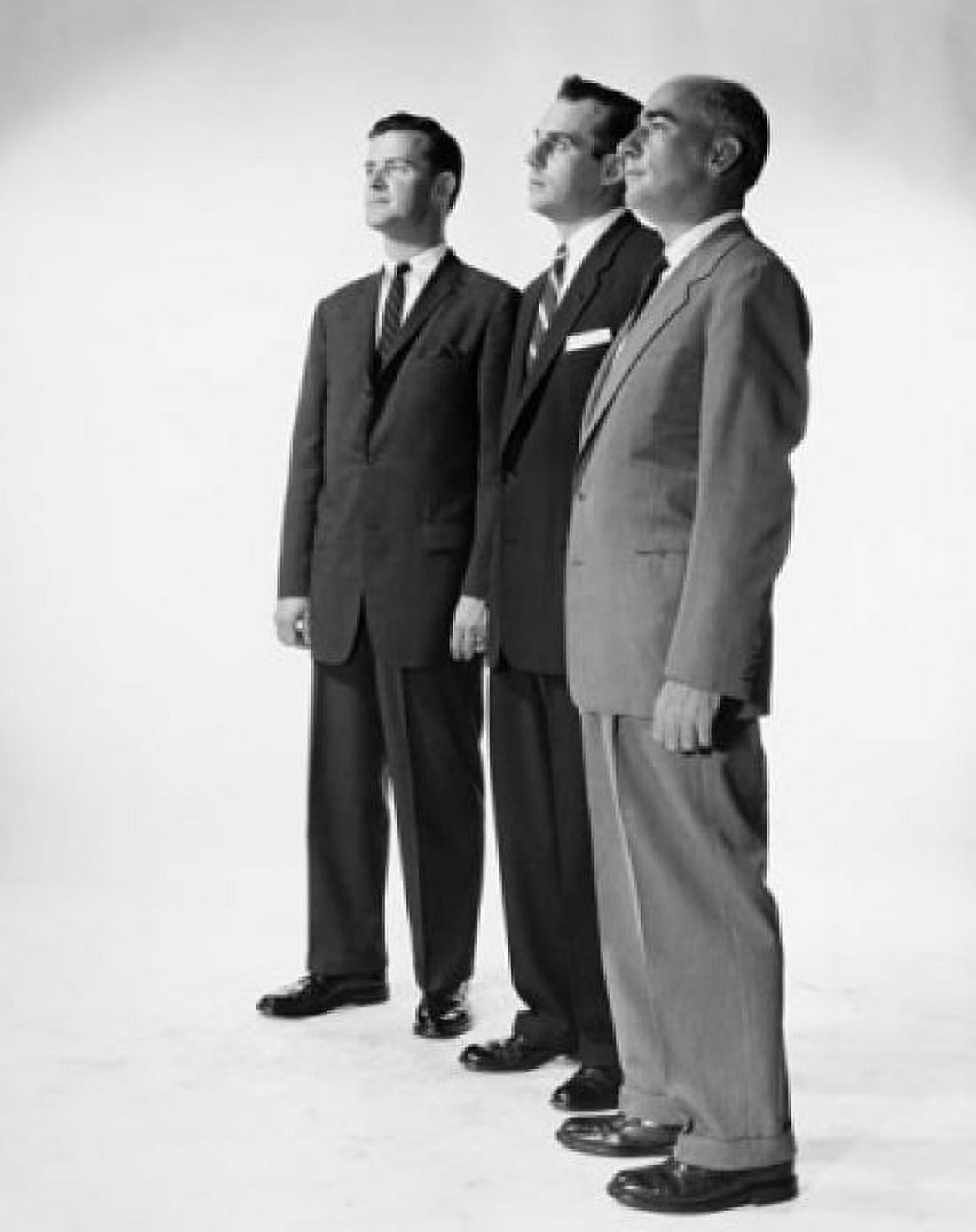 Side profile of three businessmen standing side by side Canvas Art - (24 x 36)
