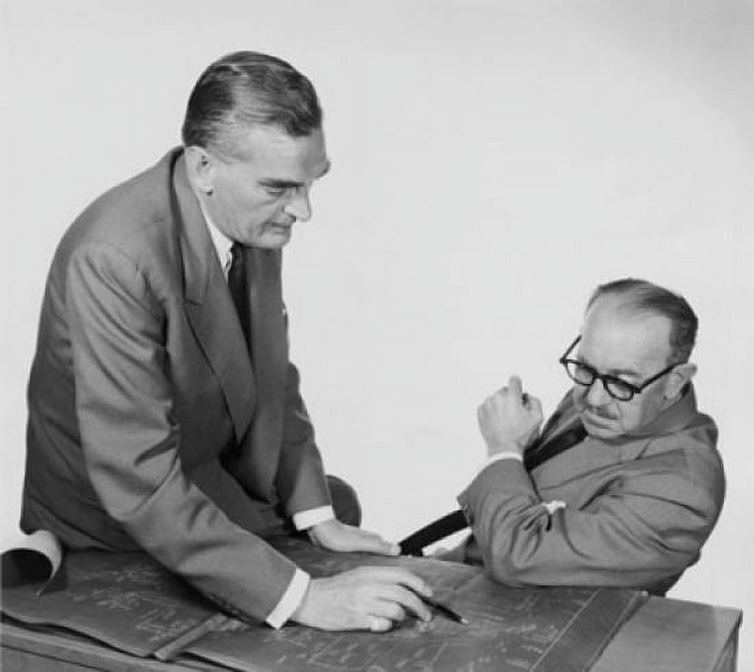 Side profile of two architects discussing on blueprint Canvas Art - (24 x 36)