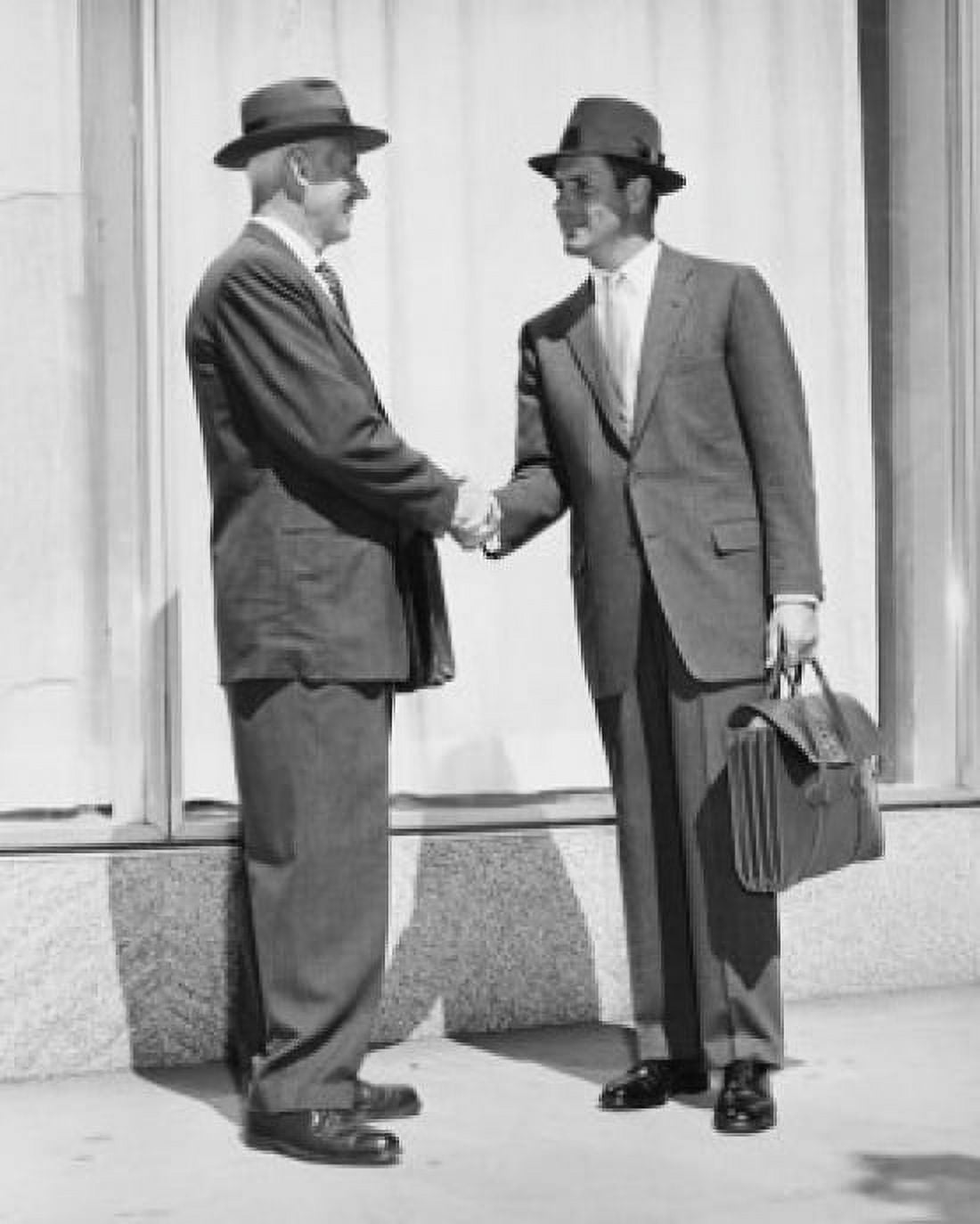 Side profile of two businessmen shaking hands Canvas Art - (24 x 36)