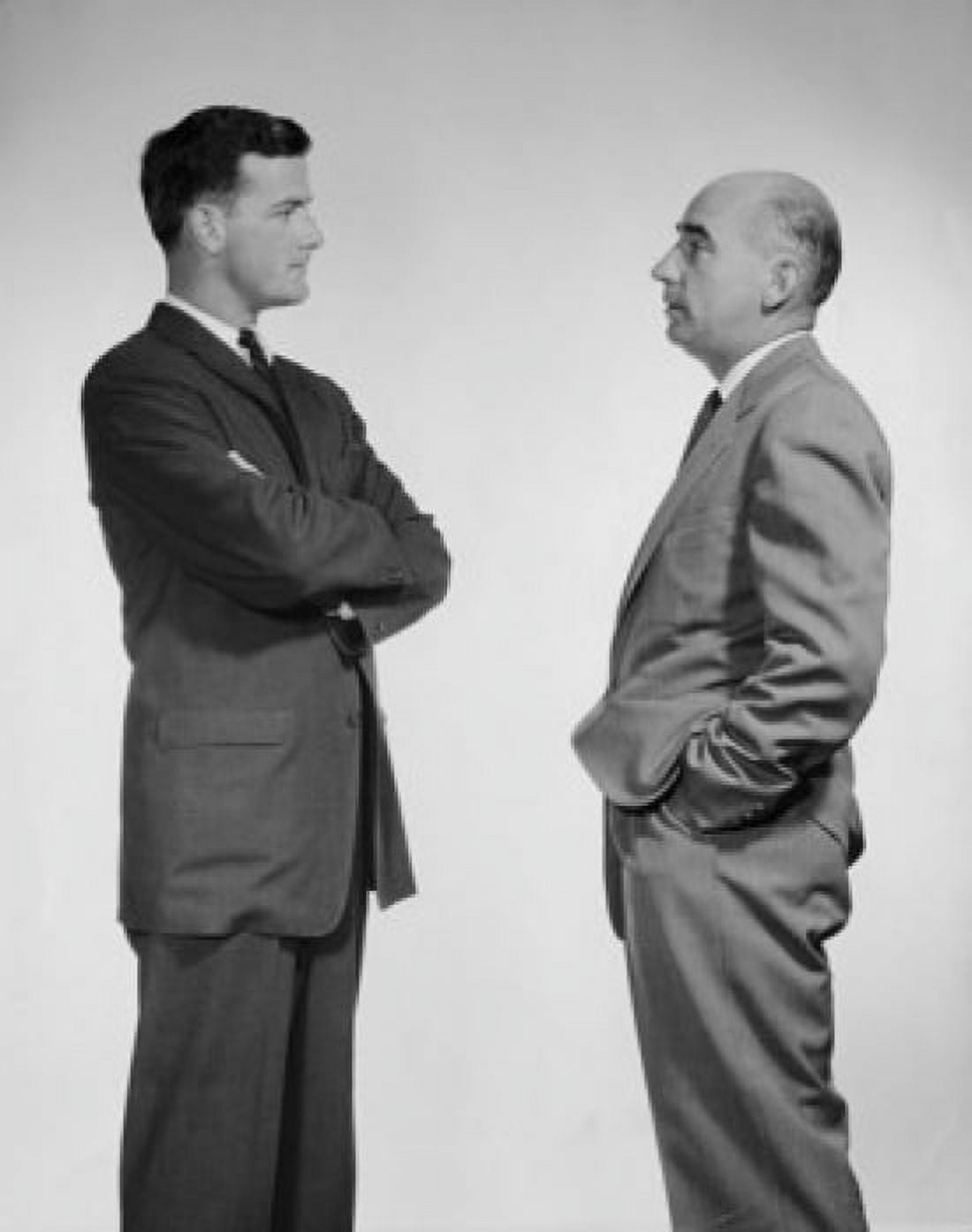 Side profile of two businessmen talking Canvas Art - (18 x 24)