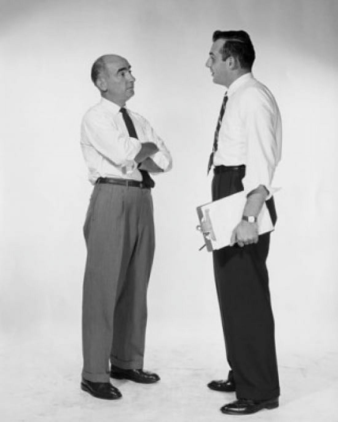Side profile of two businessmen talking Canvas Art -  (18 x 24)