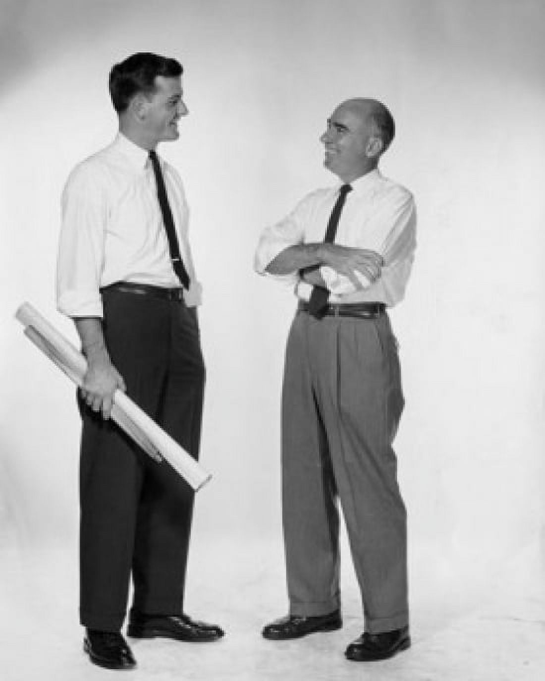 Side profile of two businessmen talking Canvas Art - (24 x 36)