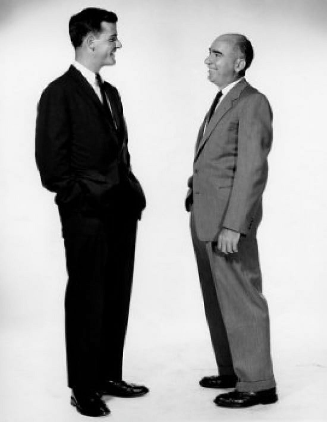 Side profile of two businessmen talking to each other Canvas Art - (18 x 24)