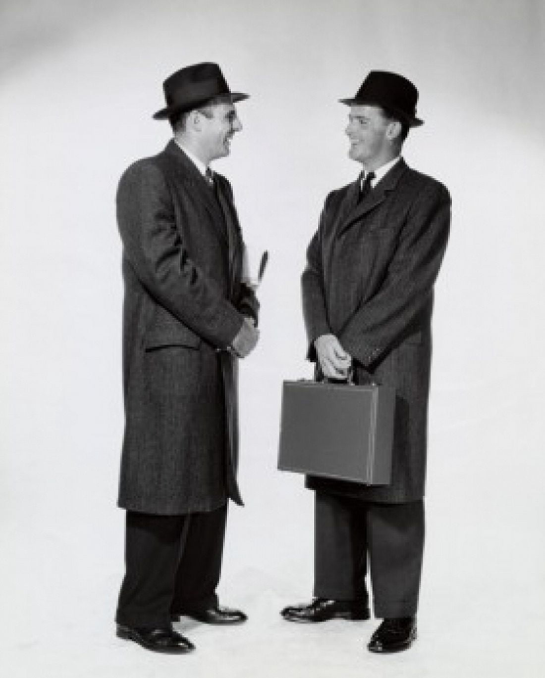 Side profile of two businessmen talking to each other Canvas Art - (24 x 36)