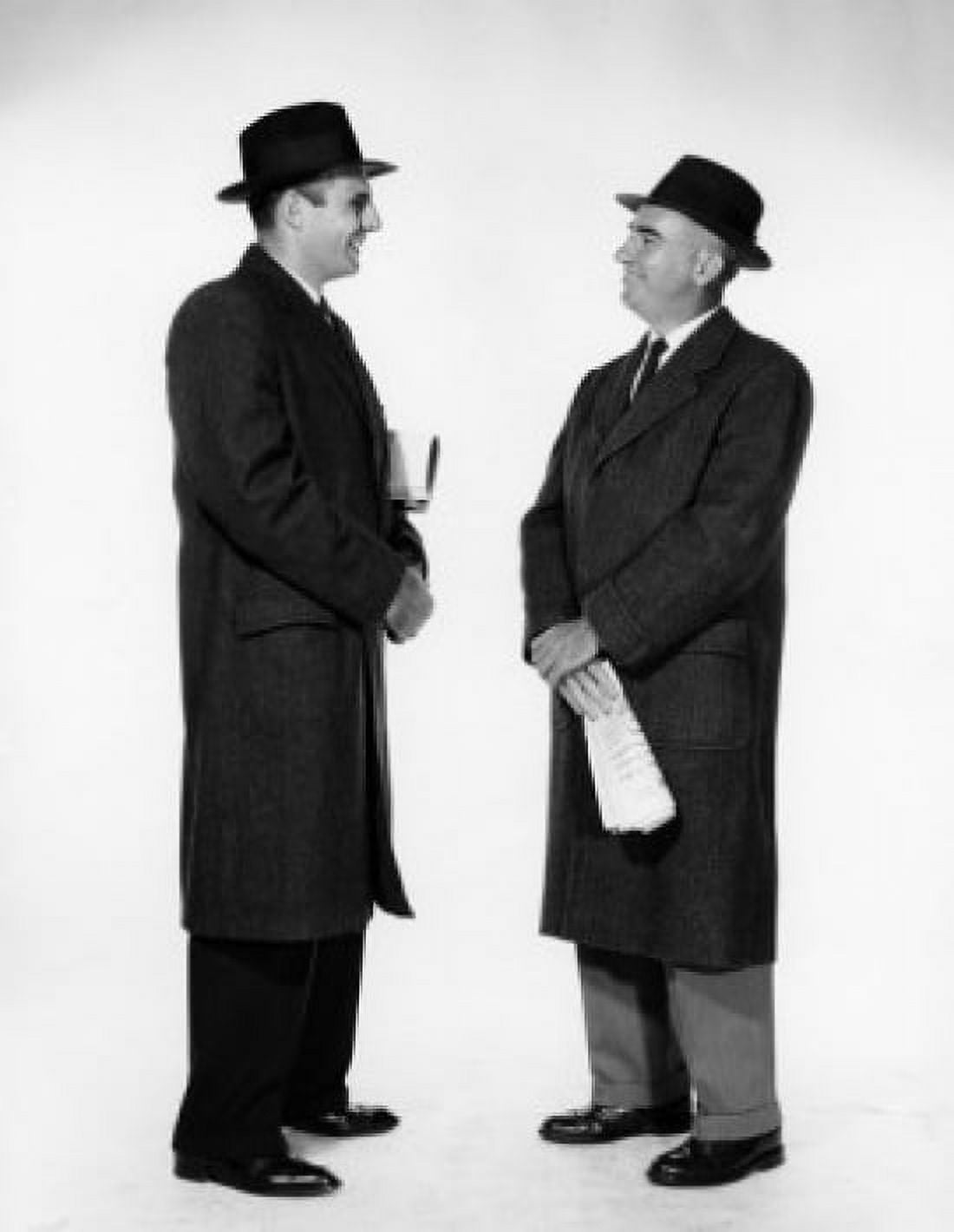Side profile of two businessmen talking to each other Canvas Art - (24 x 36)