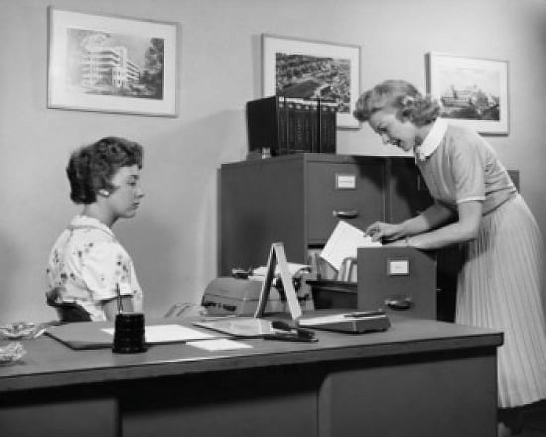 Side profile of two businesswomen working in office Canvas Art - (18 x 24)