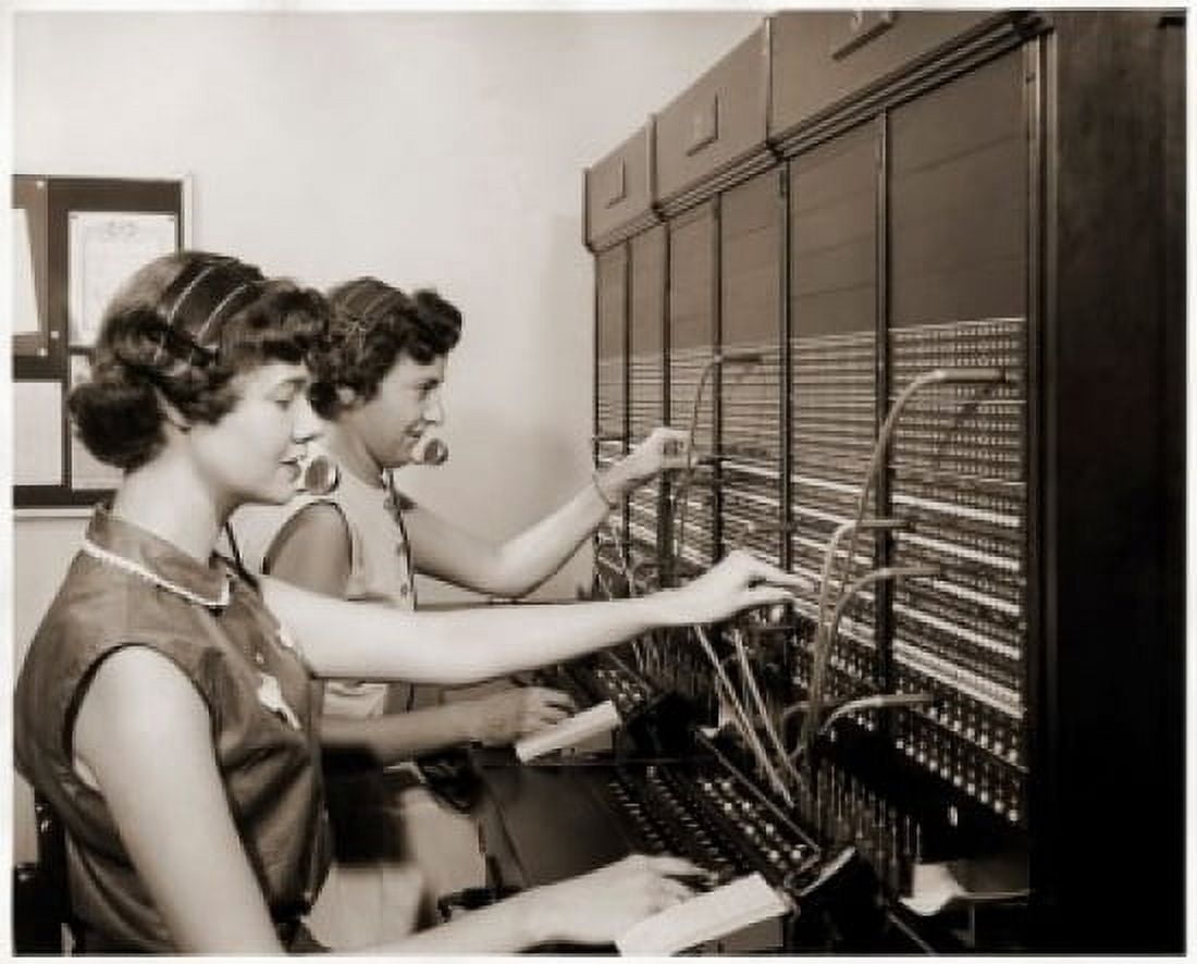 Side profile of two female telephone operators operating a switchboard Canvas Art - (24 x 36)
