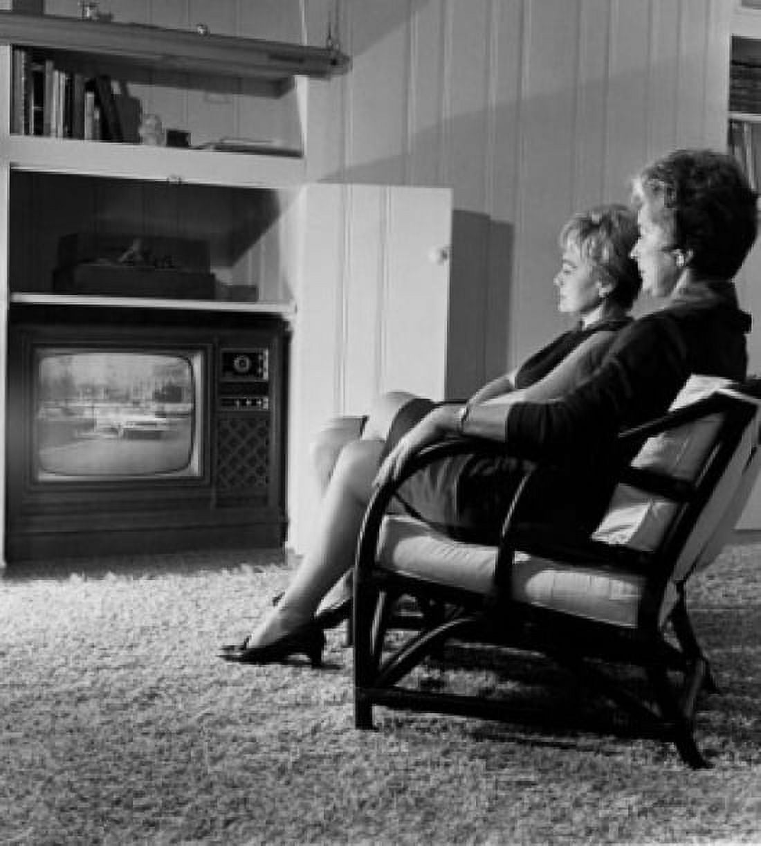 Side profile of two mature women watching television Canvas Art - (18 x 24)