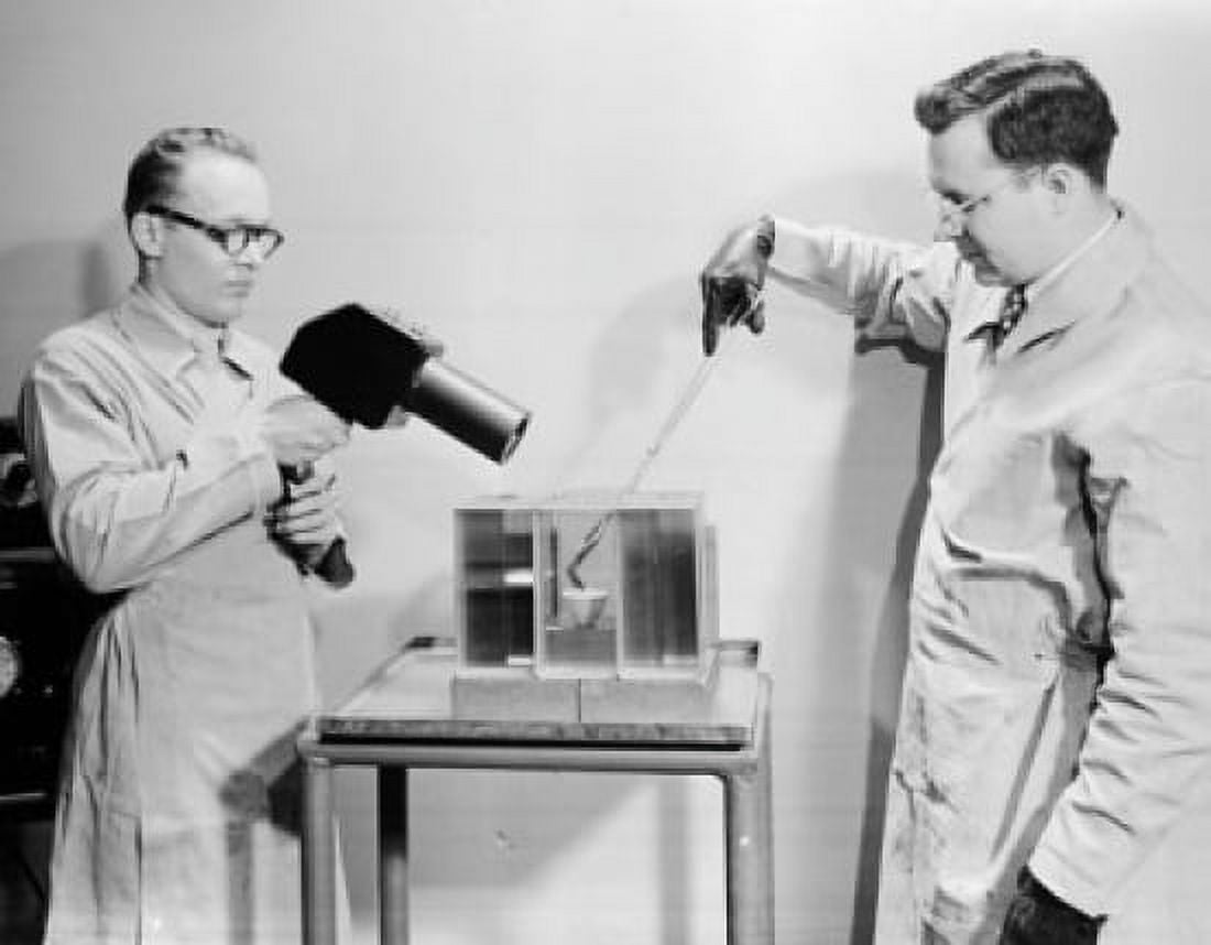 Side profile of two scientists experimenting in a laboratory PPG Industries Canvas Art - (18 x 24)