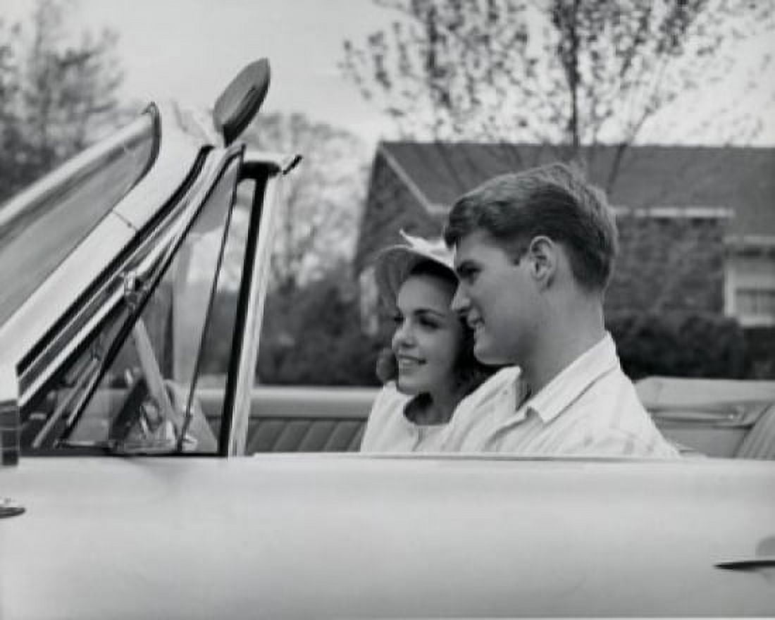 Side profile of young couple sitting in convertible car Canvas Art - (24 x 36)