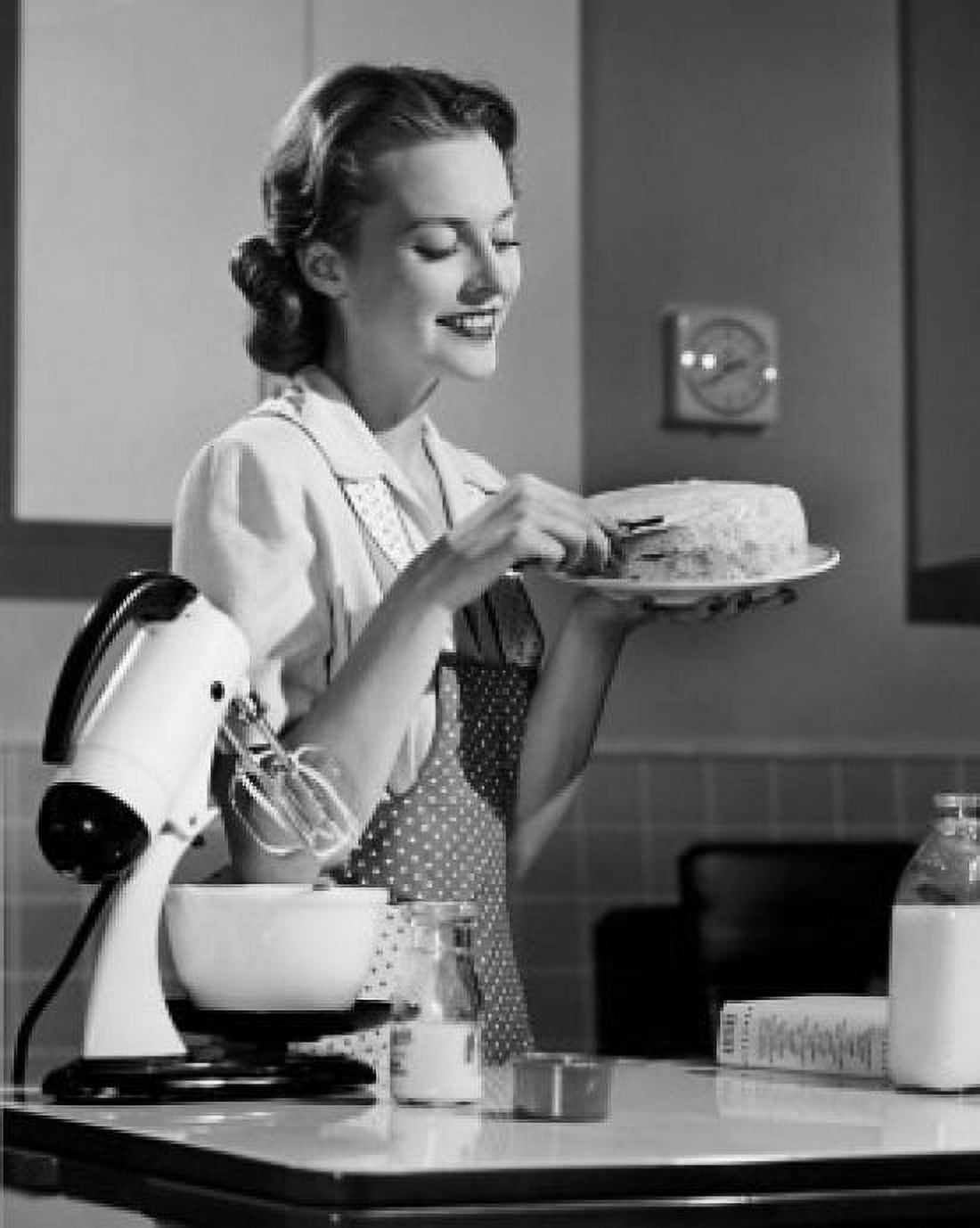 Side profile of young woman holding cake and smiling Canvas Art - (24 x 36)
