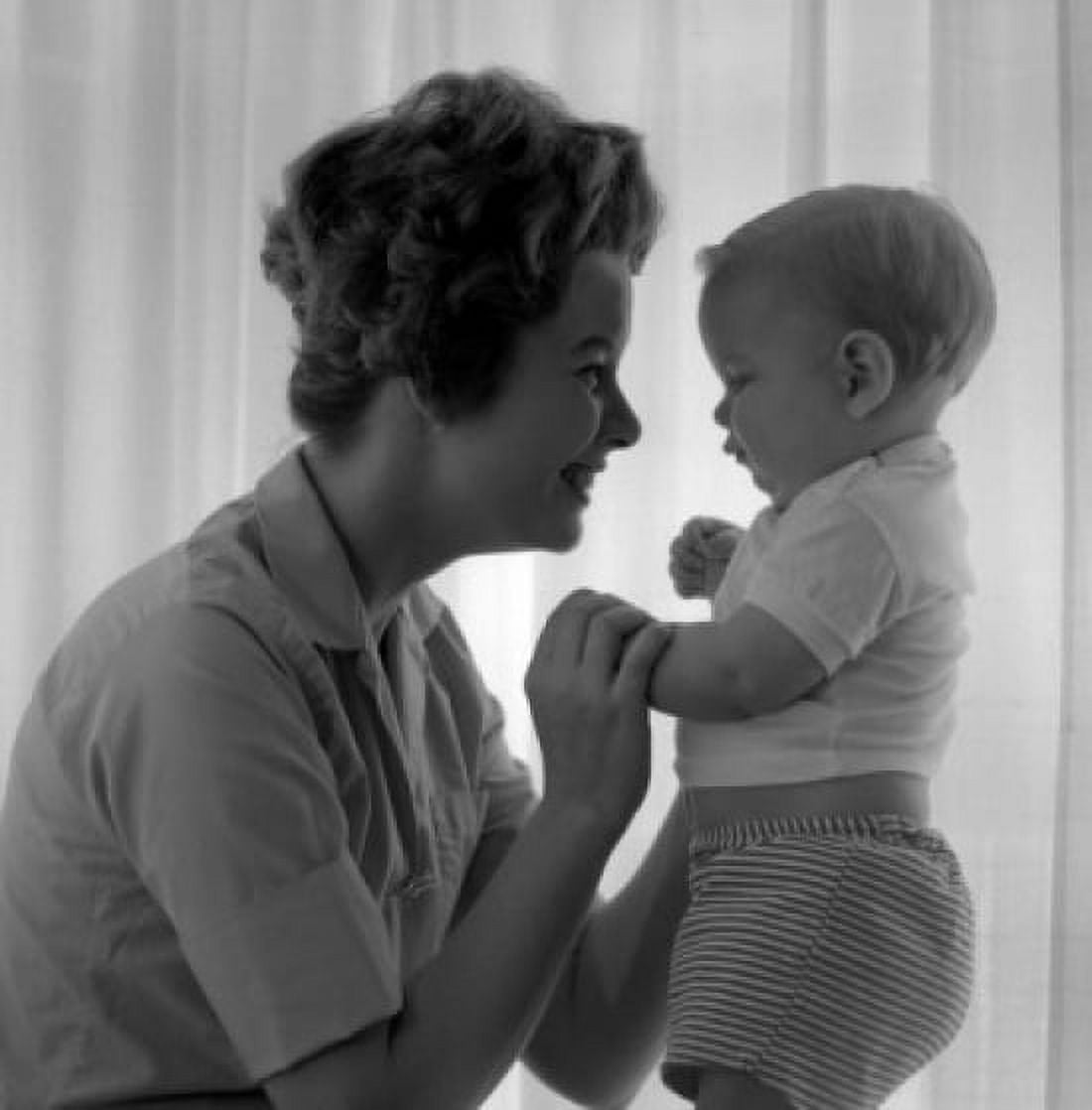Side view of young woman playing with baby boy Canvas Art - (18 x 24)