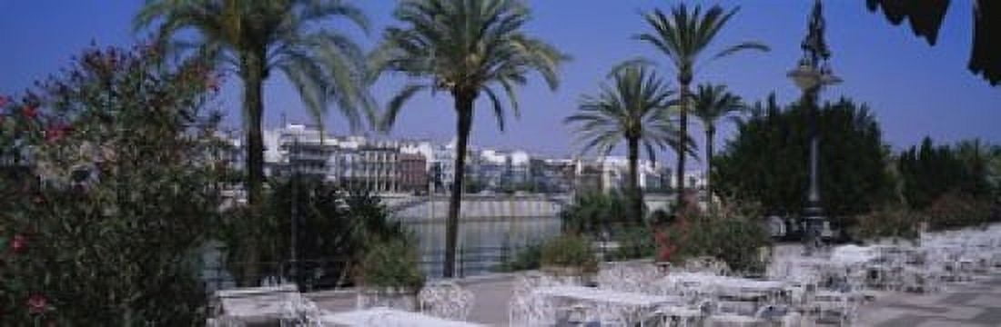 Sidewalk cafe at the riverside Guadalquivir River Seville Spain Canvas Art - Panoramic Images (18 x 6)