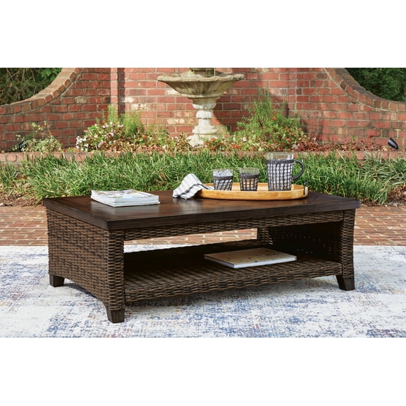 Signature Design by Ashley Drakes Beach Outdoor Rectangular Coffee Table, Dark Brown, Wicker Patio Cocktail Table with Storage Shelf