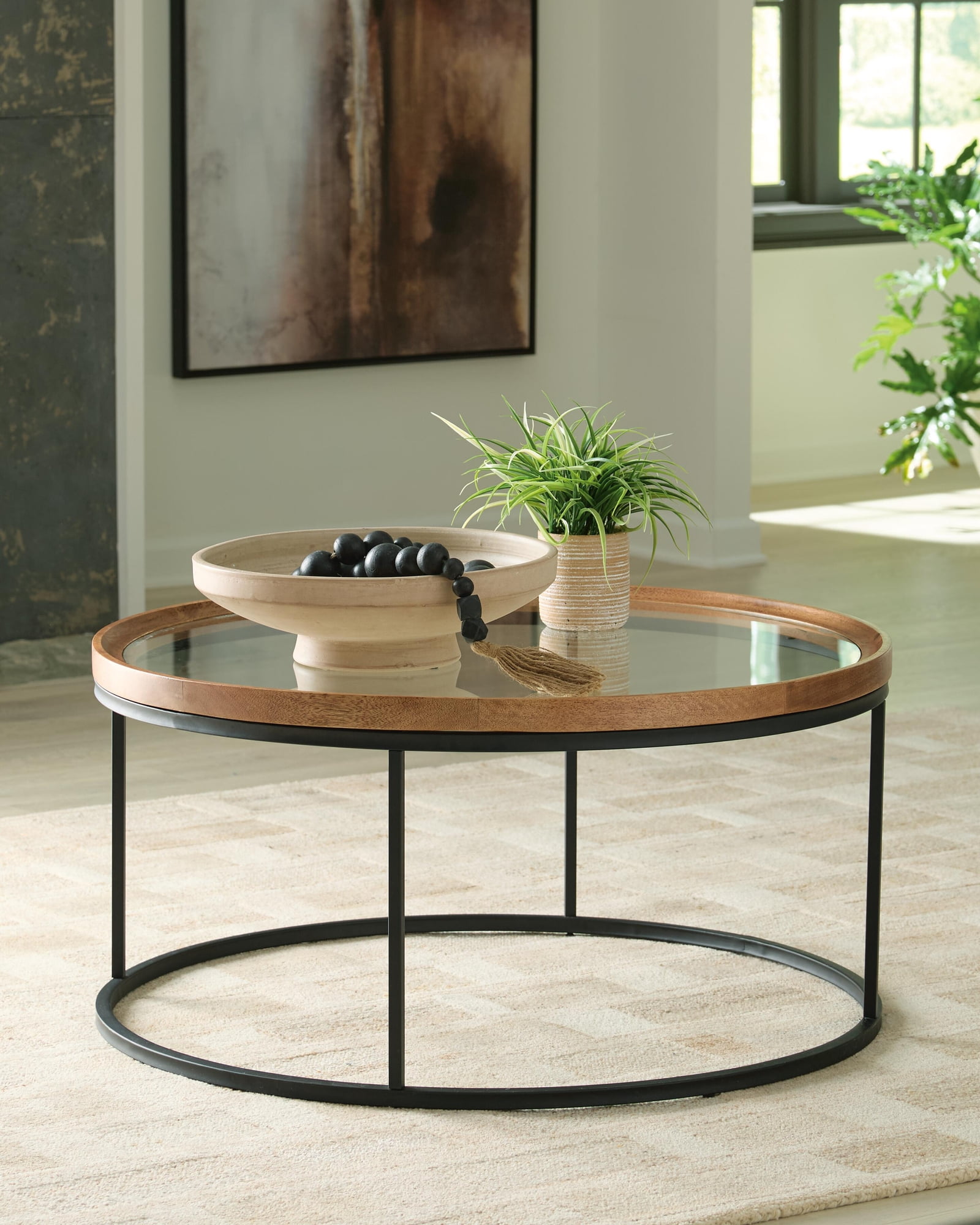 Signature Design By Ashley Noraluna Round Cocktail Table in Medium Brown/Black