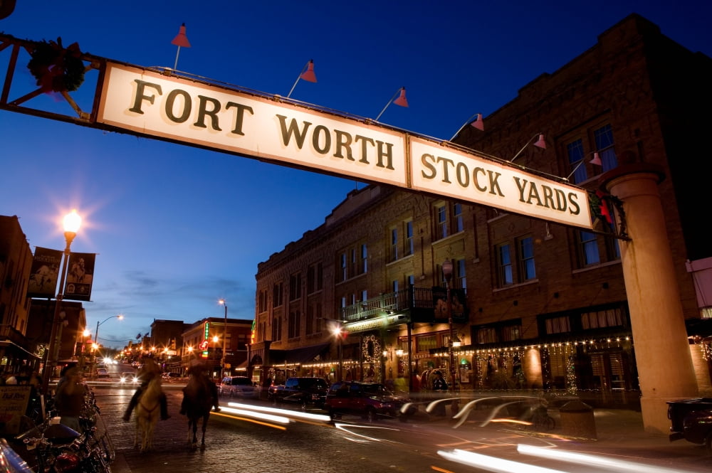 Signboard over a road at dusk Fort Worth Stockyards Fort Worth Texas USA Canvas Art - Panoramic Images (36 x 12)