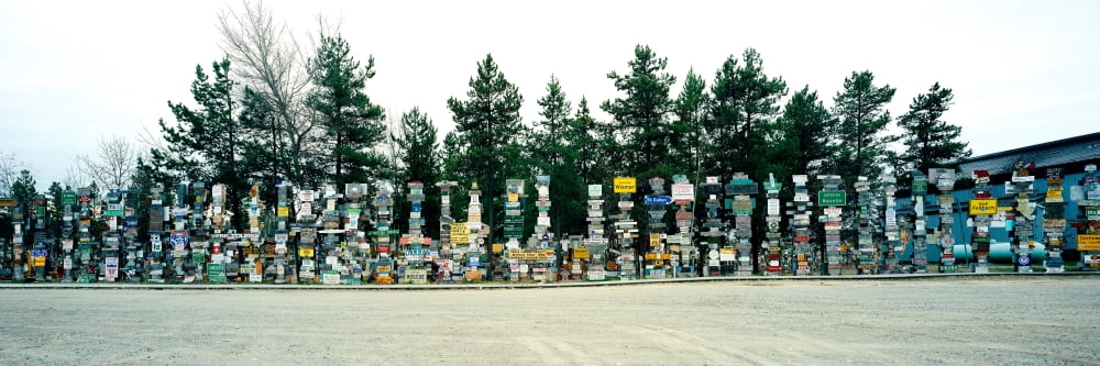 Signposts at the roadside Sign Post Forest Watson Lake Yukon California USA Canvas Art - Panoramic Images (6 x 18)